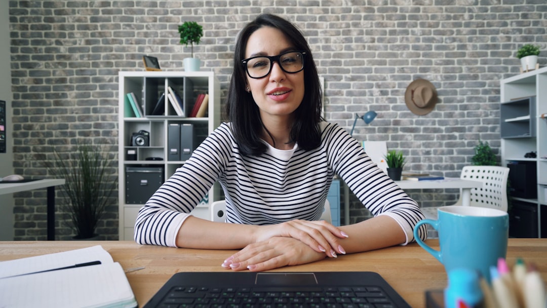 A teacher conducting an online class from a laptop